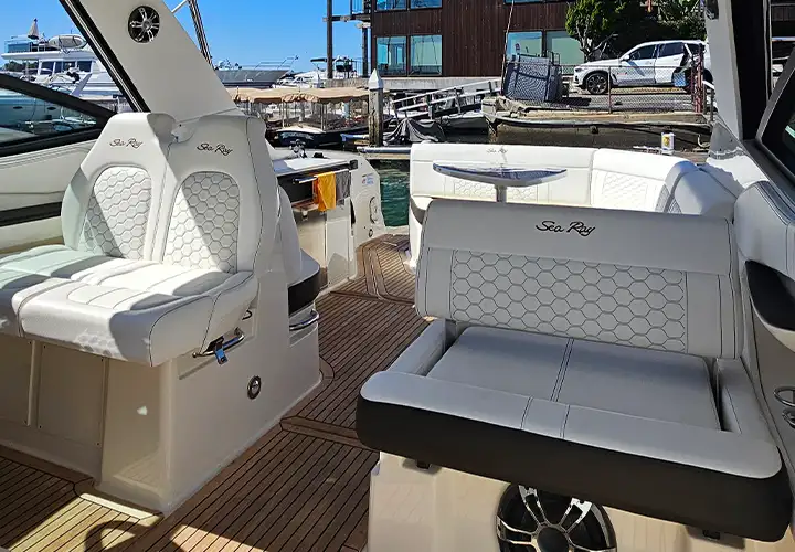 Captain and companion chairs beneath the Sea Ray hardtop