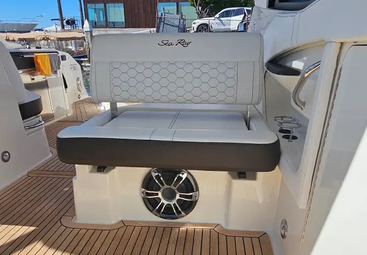 Quilted companion seat with Sea Ray embroidery and a speaker below